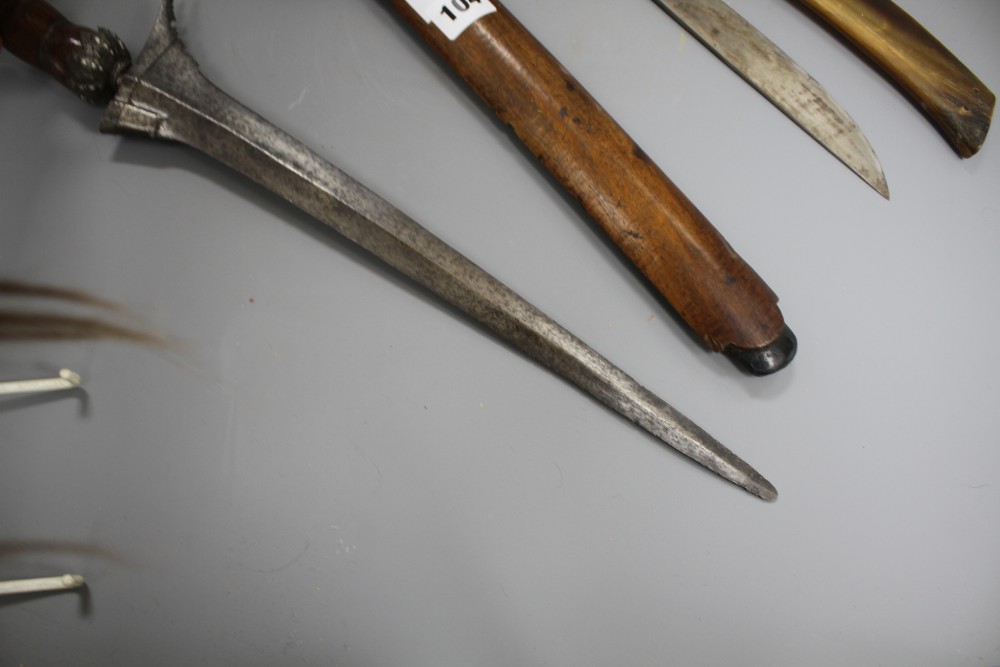 A Kris with hardwood handle and scabbard and another similar with horn scabbard